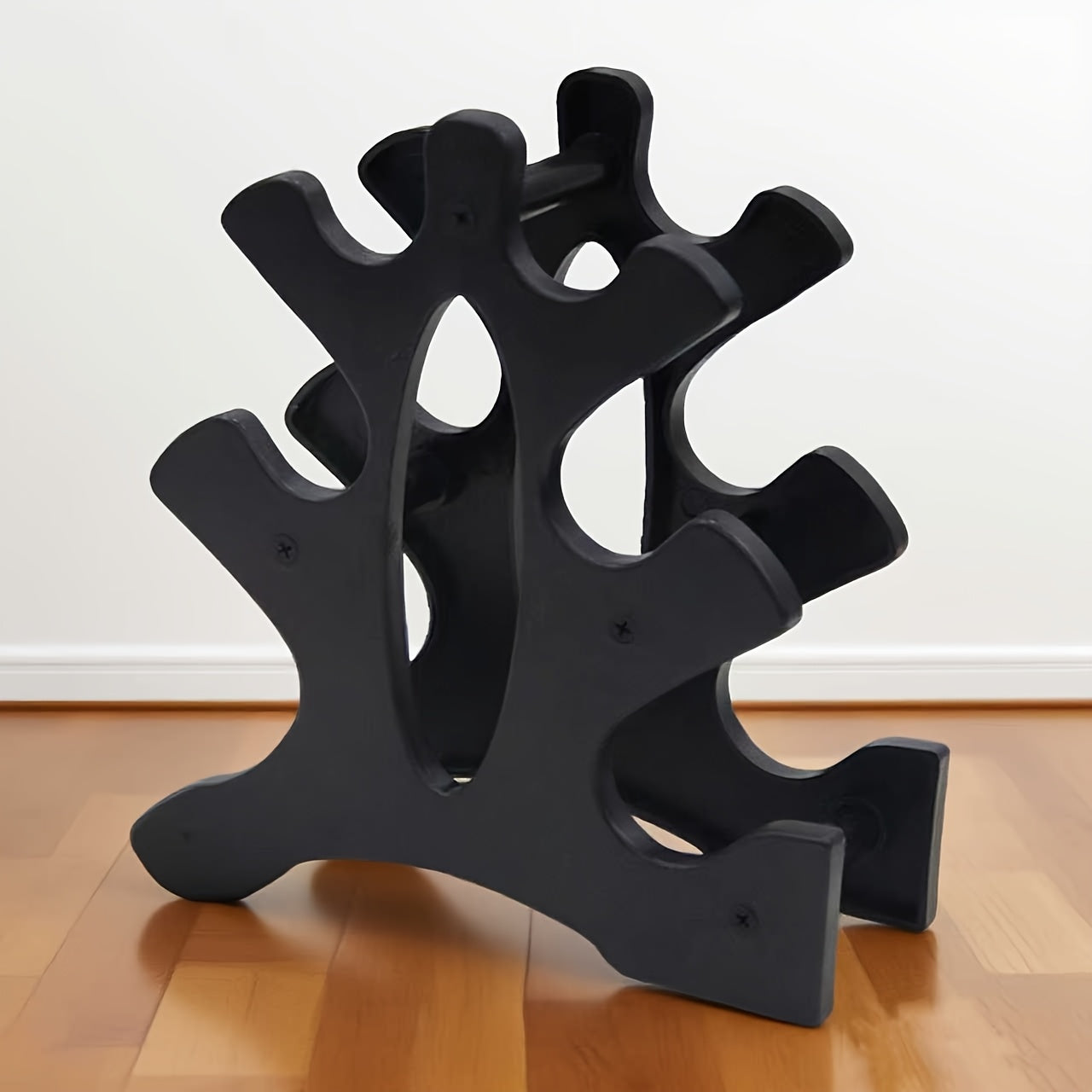 Râtelier triple pour haltères en ABS robuste, compact et stable, capacité 6 haltères par côté, parfait pour gym à domicile ou professionnel.