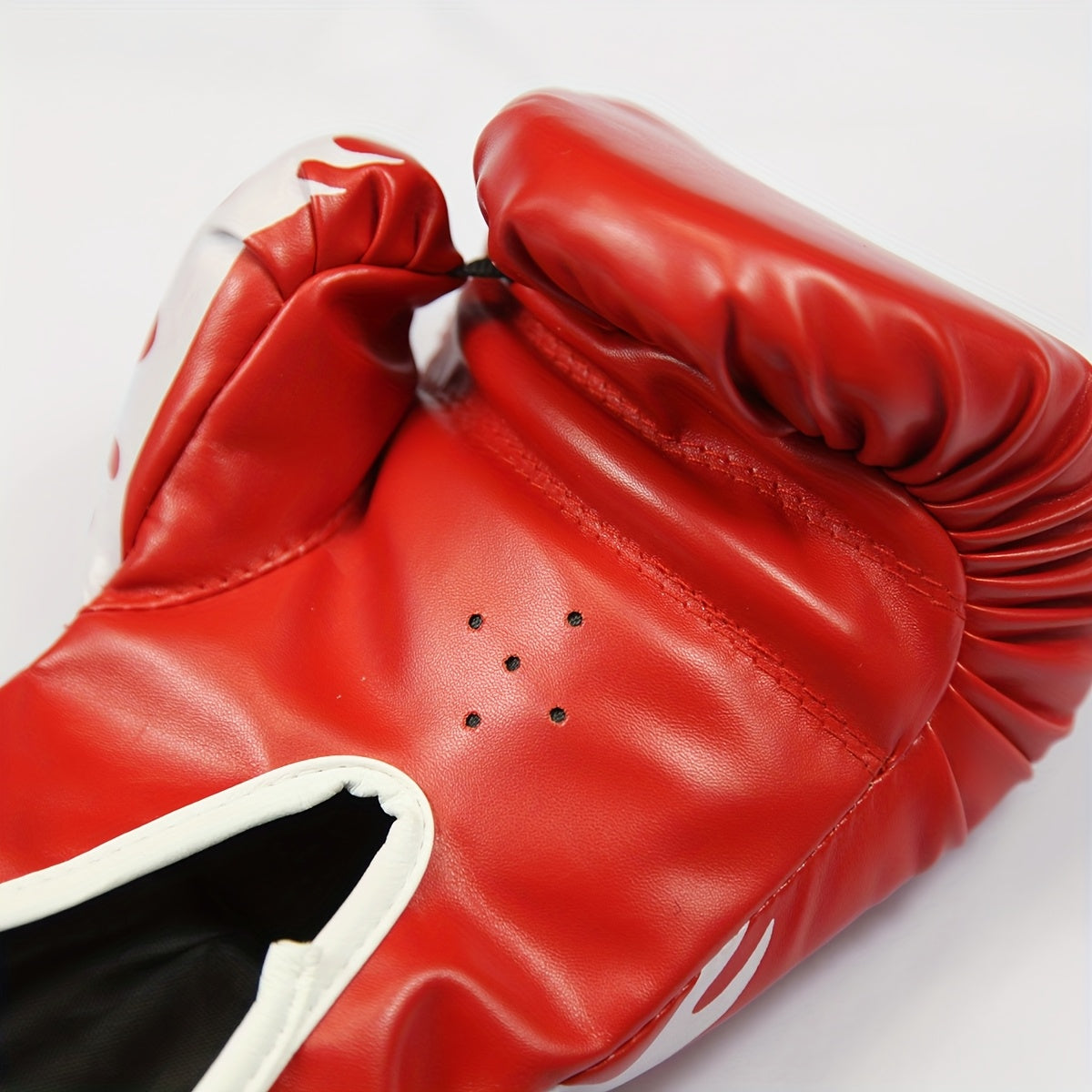 Pair of 6 oz youth boxing gloves with thick foam padding, suitable for amateur and professional training.