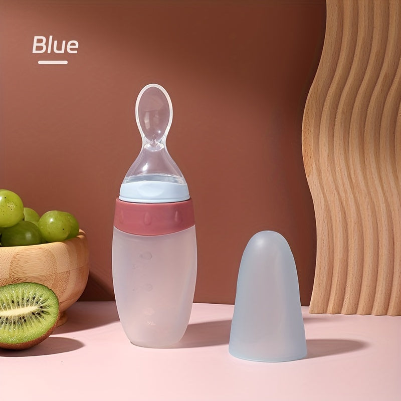 Biberon doseur 100 ml en silicone liquide, avec cuillère intégrée, idéal pour nourrir bébé avec pâte de riz ou aliments liquides.