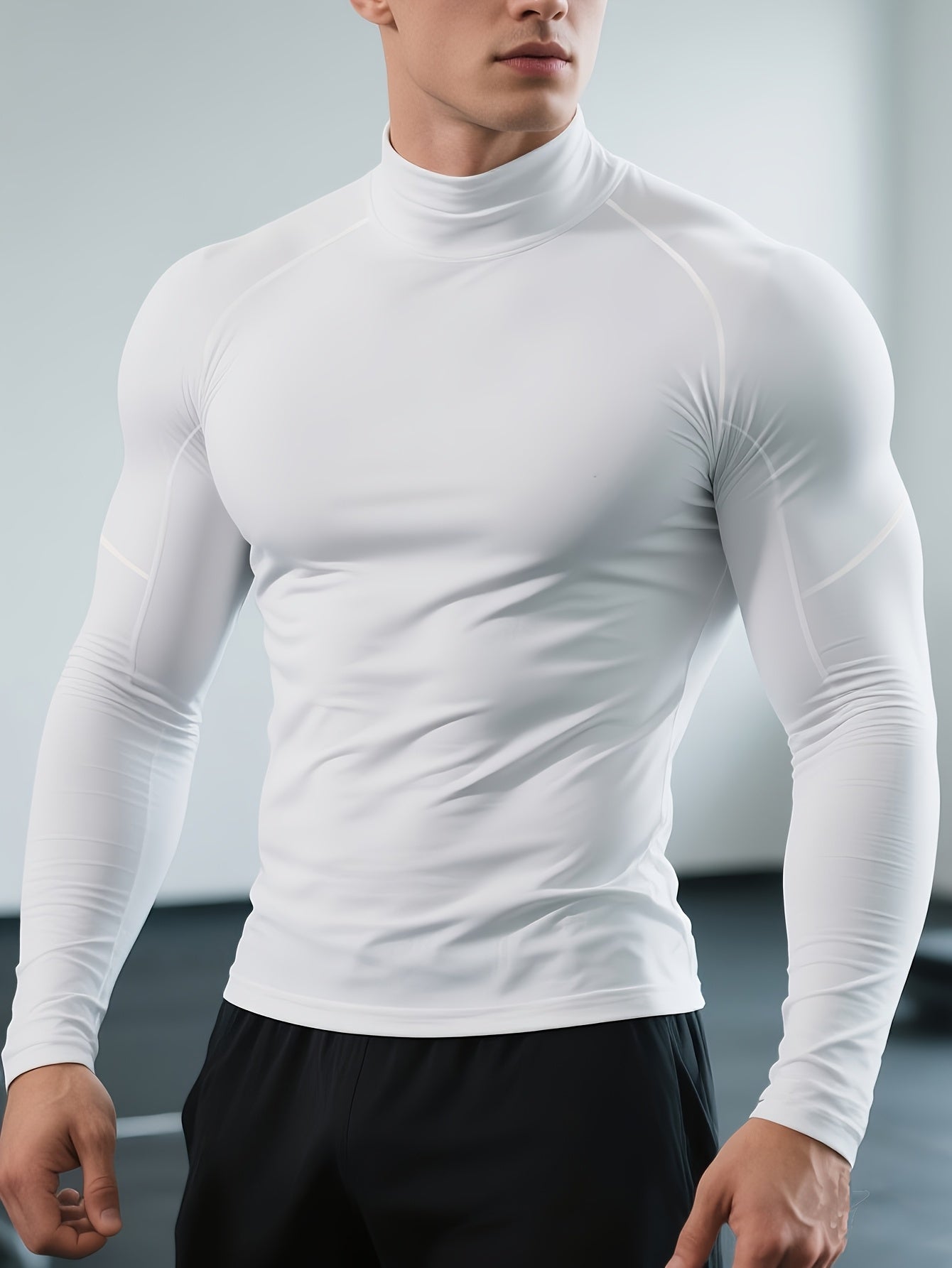 Men's long-sleeved thermal T-shirt, slim fit, stretch fabric, high collar, ideal for sports, running and outdoor activities in cold conditions.