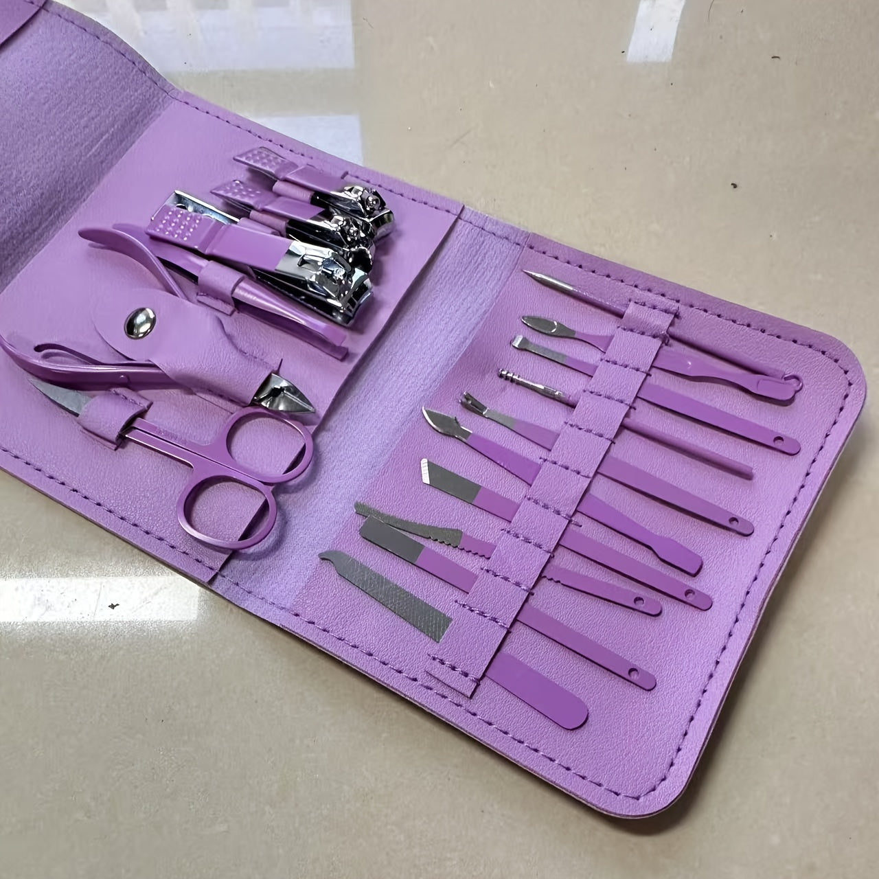 16-piece stainless steel nail care set, file, ear pick and scissors, modern style, ideal for travel and professional use.