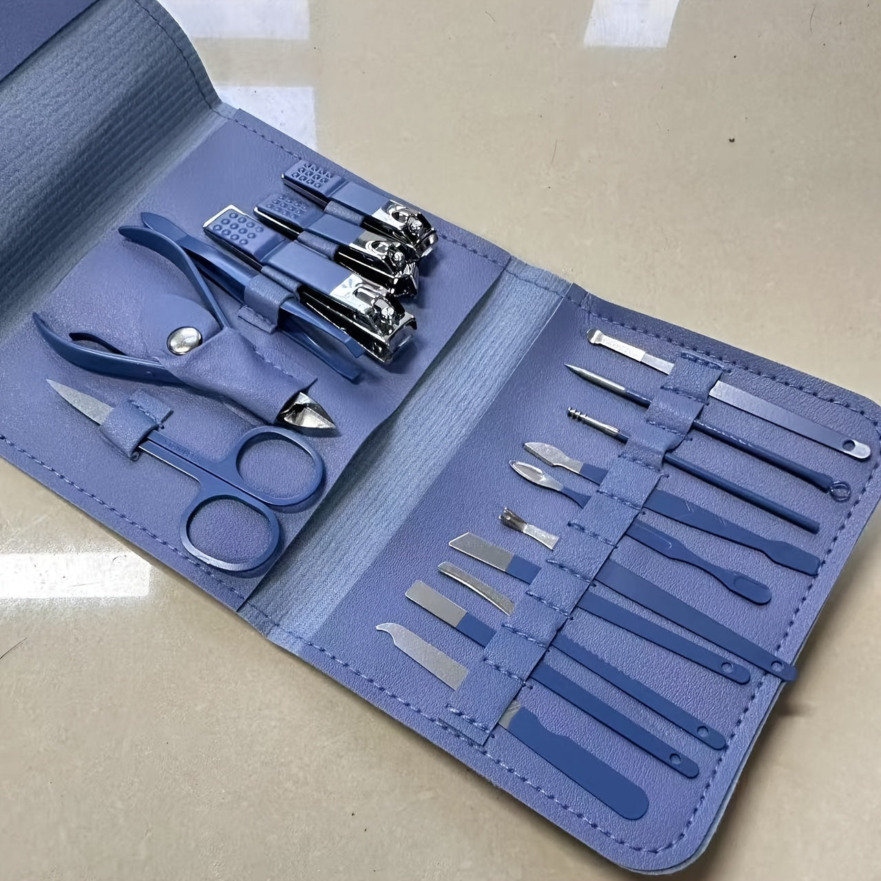 16-piece stainless steel nail care set, file, ear pick and scissors, modern style, ideal for travel and professional use.