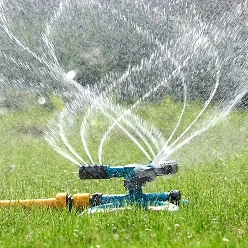 360° rotating sprinkler head, efficient garden irrigation, adjustable flow rate, complete lawn and plant coverage, green plastic design.