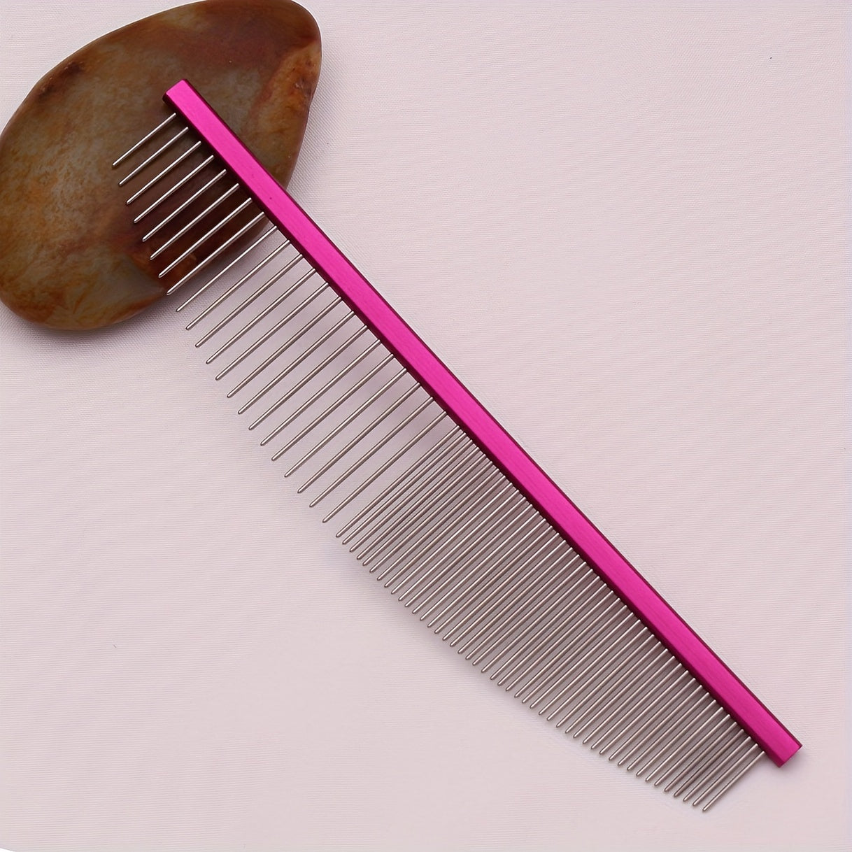 Stainless steel pet grooming comb. Aluminium handle, detangles knots and removes dead hair.