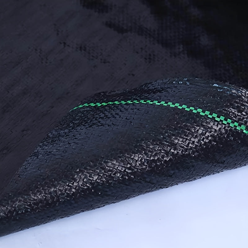 Rouleau de toile anti-mauvaises herbes noire, PP durable, surface texturée, contrôle efficace des mauvaises herbes, idéal fleurs, légumes et aménagement paysager.