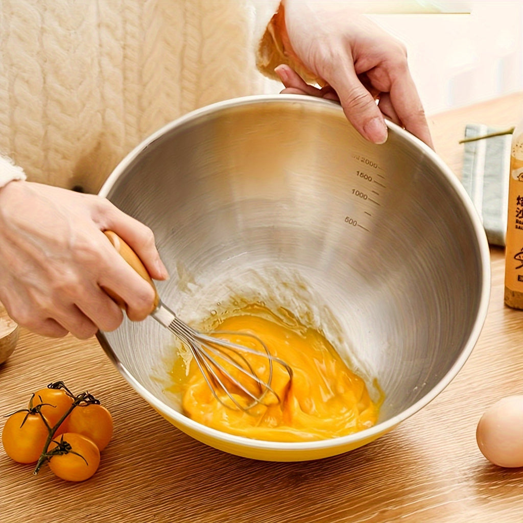 Ustensiles de pâtisserie avec saladier gradué en acier inoxydable, idéal pour mélange, stockage alimentaire et préparation de repas.