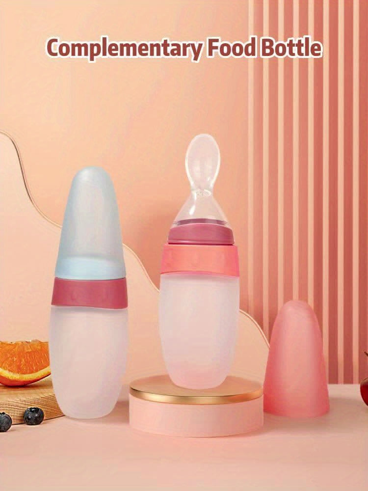 Biberon doseur 100 ml en silicone liquide, avec cuillère intégrée, idéal pour nourrir bébé avec pâte de riz ou aliments liquides.