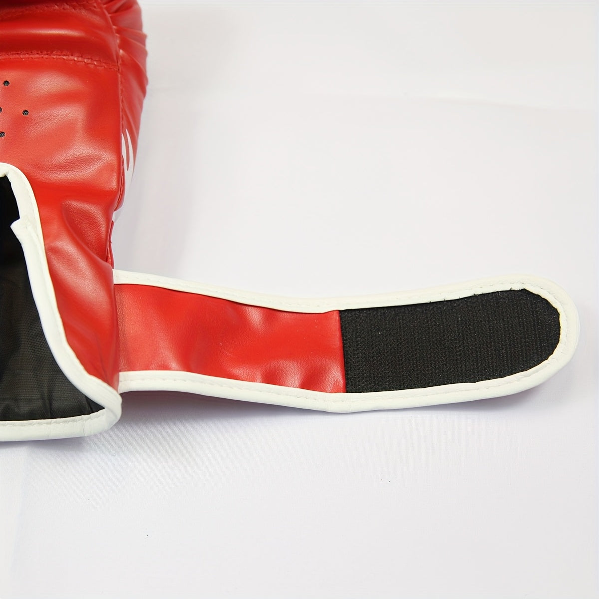 Pair of 6 oz youth boxing gloves with thick foam padding, suitable for amateur and professional training.