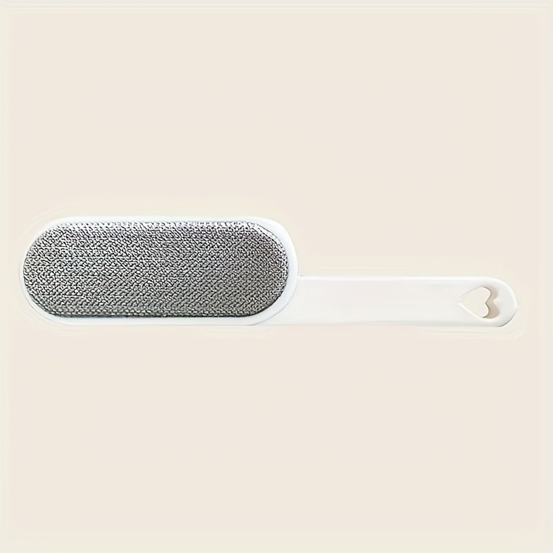 Brosse manuelle à double face pour poils et peluches. Bristles robustes, sans électricité, idéale pour vêtements, meubles, tapis et voyages.
