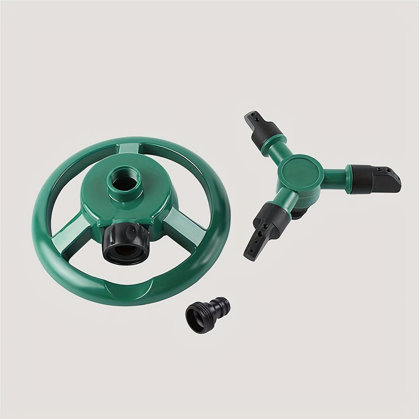 360° rotating sprinkler head, efficient garden irrigation, adjustable flow rate, complete lawn and plant coverage, green plastic design.