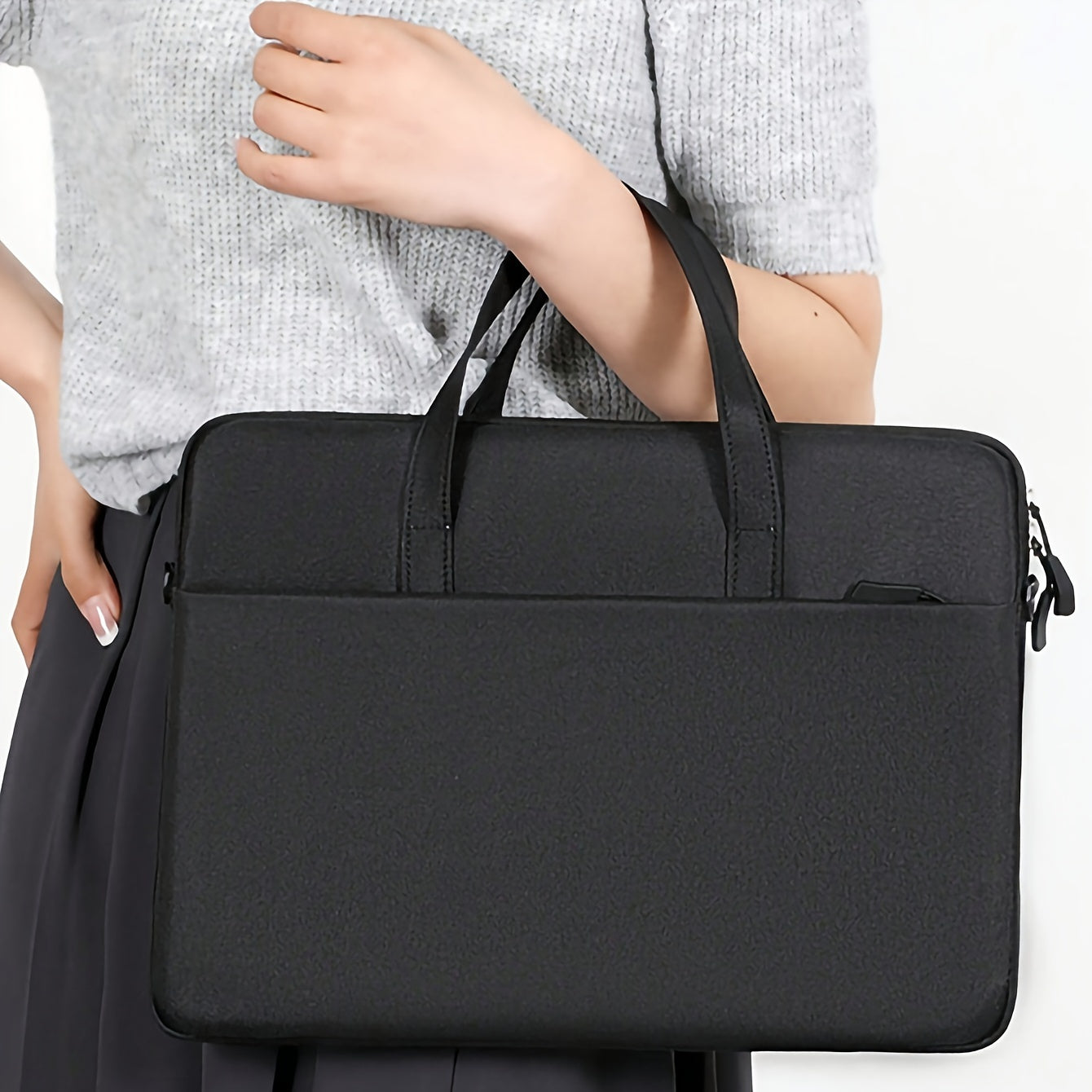 Sac ordinateur portable léger et portable, couleur unie, protection pour déplacements professionnels, design bandoulière avec fermeture éclair, pratique pour bureau et voyage.