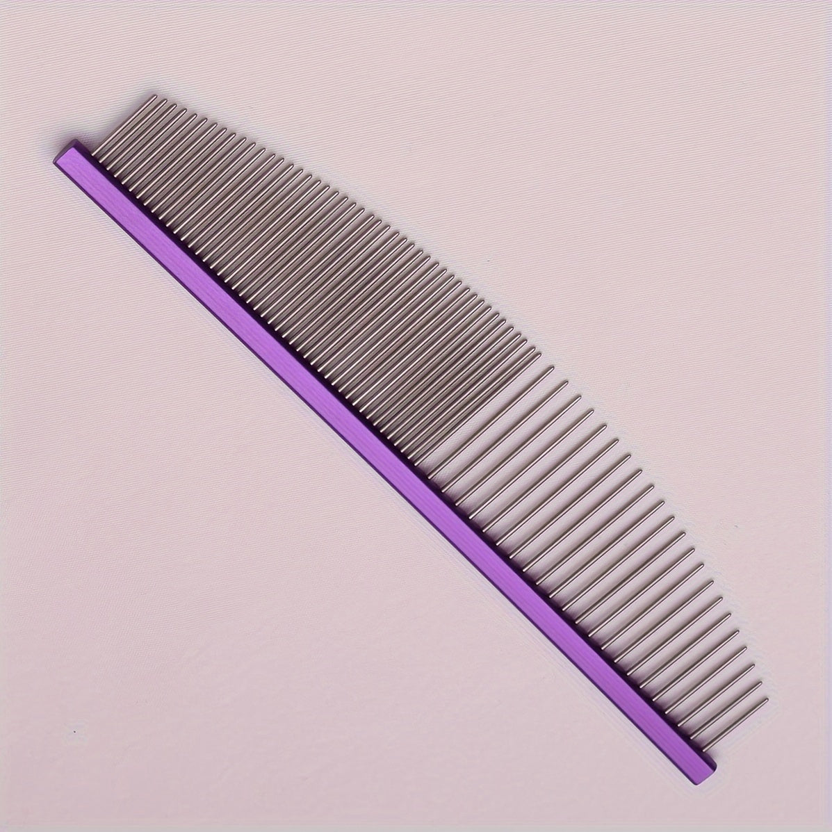 Stainless steel pet grooming comb. Aluminium handle, detangles knots and removes dead hair.