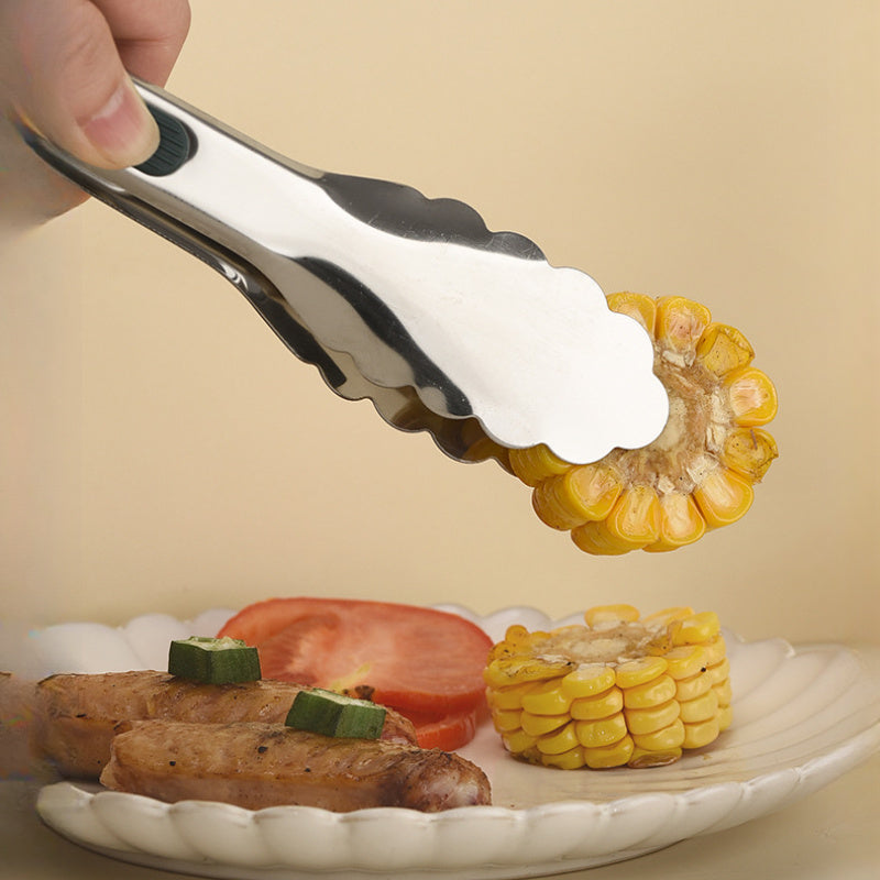 Pinces alimentaires inox avec poignées silicone : résistantes à la chaleur, durables, prise sûre. Idéales pour buffet, BBQ et cuisine extérieure.