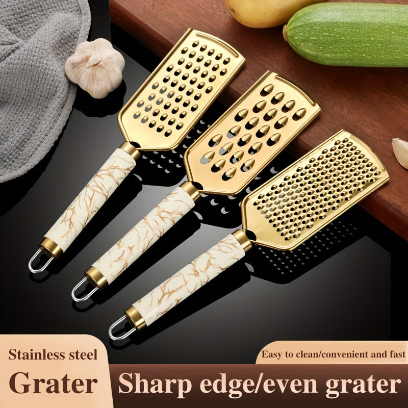 Râpe en Acier Inoxydable (1 ou 3 pcs) : Pour légumes, fruits et fromage, poignée sécurisée, design doré, râpe sûre et pratique pour cuisine maison.