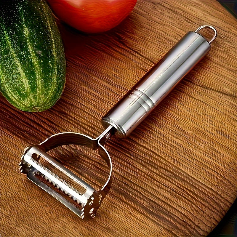 Multifunctional stainless steel peeler and slicer, sharp blade, for potatoes, carrots, ergonomic handle, easy and efficient preparation, durable design.