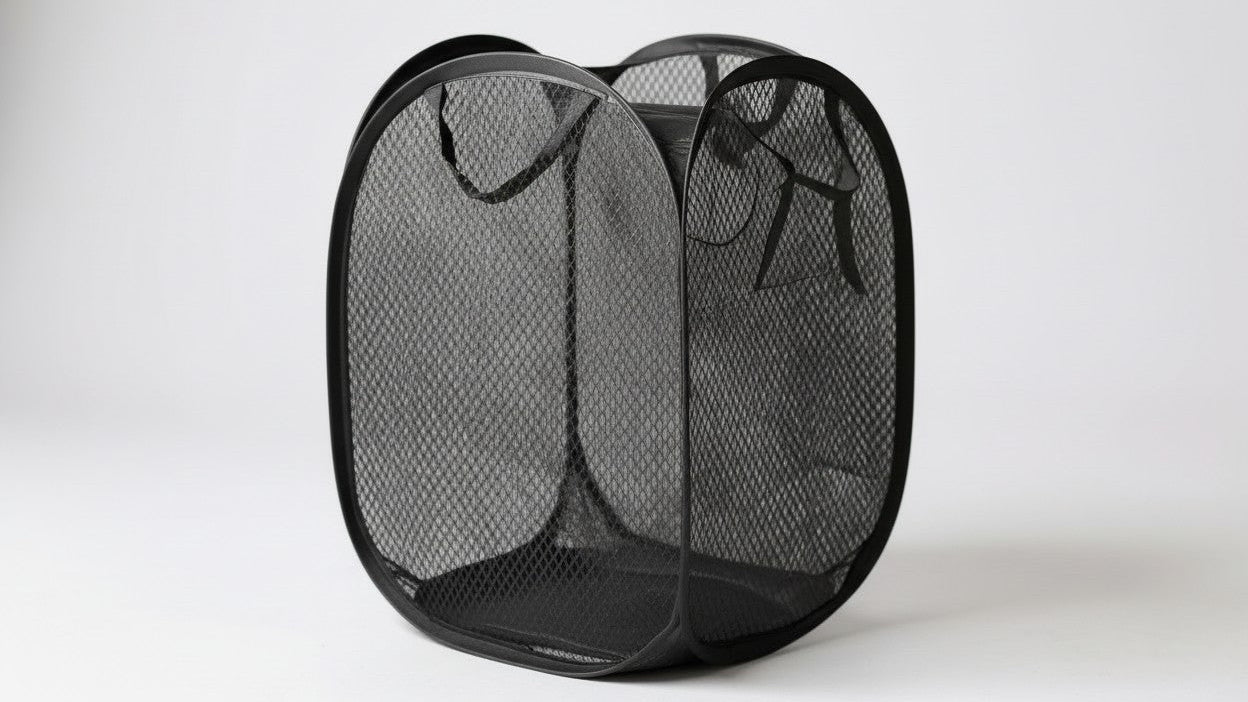 Large capacity collapsible mesh laundry basket with ergonomic handles, ideal for bedroom, bathroom or living room, available in black or red.