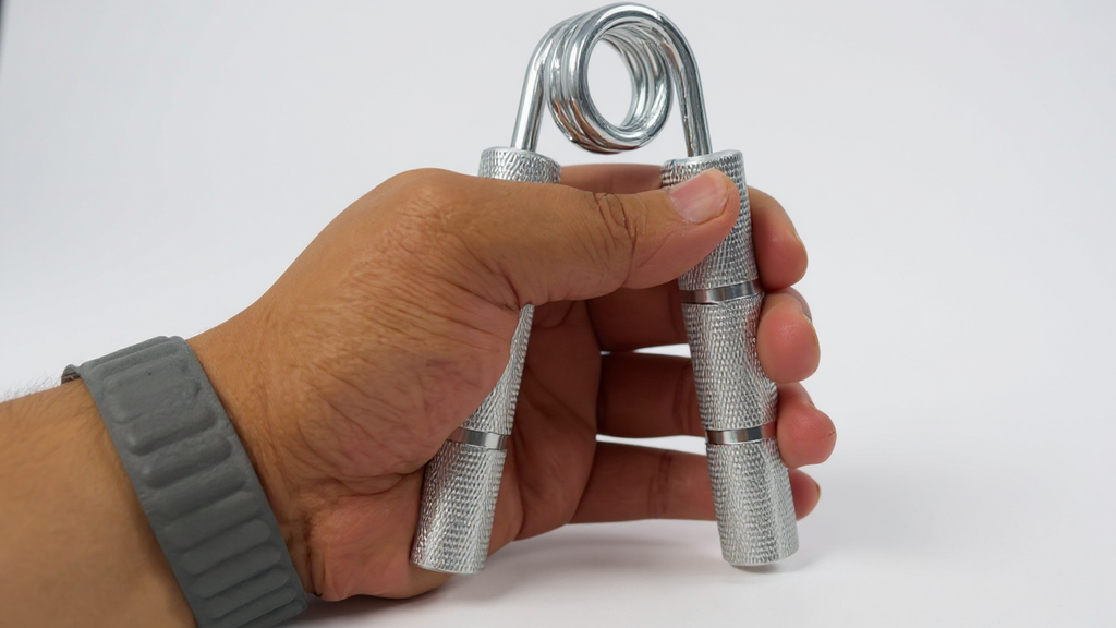 Metal hand gripper 22.68 to 158.76 kg, trains wrists and forearms, strengthening grip and hand muscles.