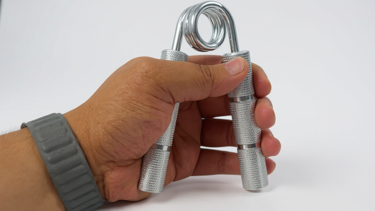 Metal hand gripper 22.68 to 158.76 kg, trains wrists and forearms, strengthening grip and hand muscles.